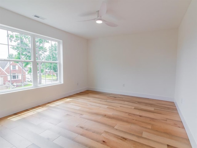 6343 Tholozan, Saint Louis, MO 63109 - spare room featuring light wood-style flooring, ceiling fan, and baseboards
