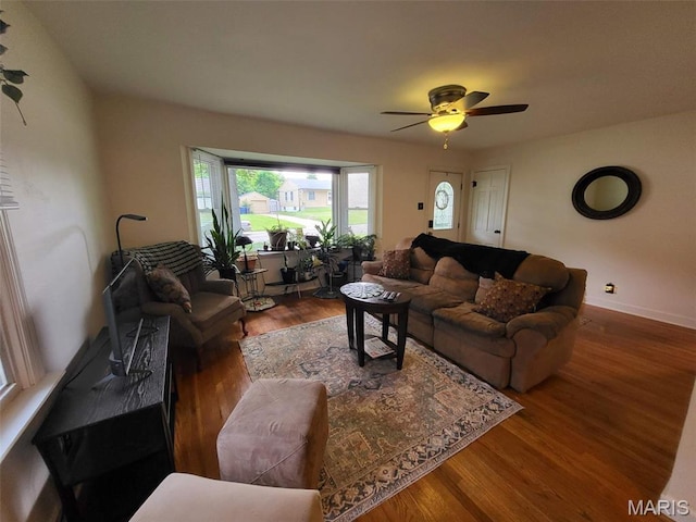 14 Banbury Ct, Crestwood, MO 63126 - living room featuring a ceiling fan, wood finished floors, and baseboards