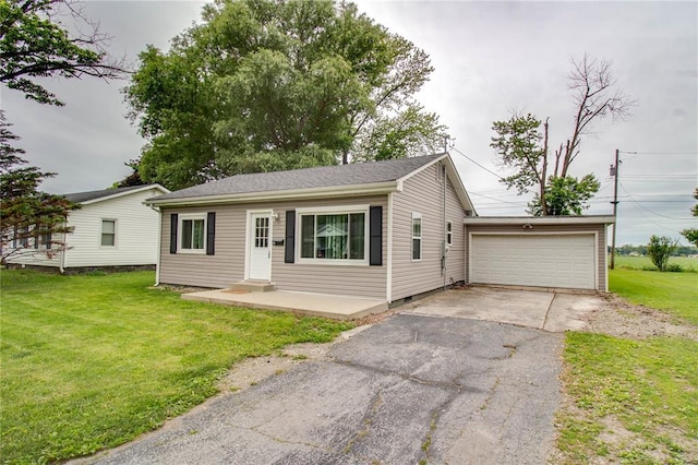 155 Roberts St, Jerseyville, IL 62052 - view of front of home featuring driveway, a garage, a front lawn, and an outbuilding