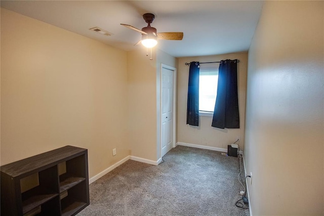 155 Roberts St, Jerseyville, IL 62052 - empty room with a ceiling fan, carpet floors, and baseboards