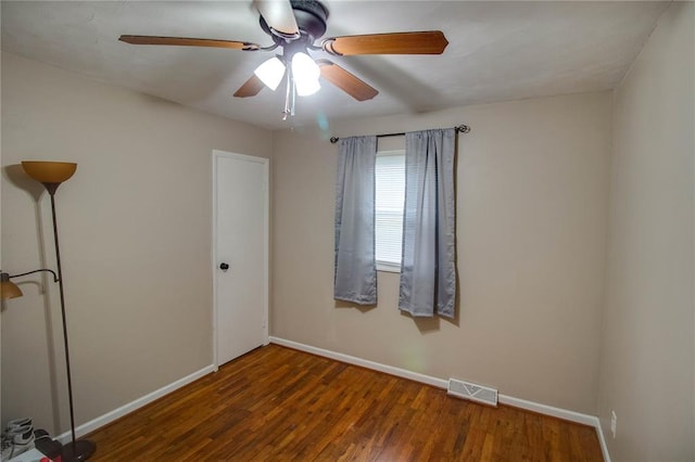 155 Roberts St, Jerseyville, IL 62052 - spare room featuring ceiling fan, baseboards, and wood finished floors