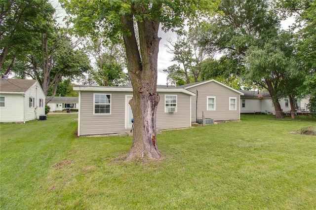 155 Roberts St, Jerseyville, IL 62052 - back of house with a lawn and central AC unit