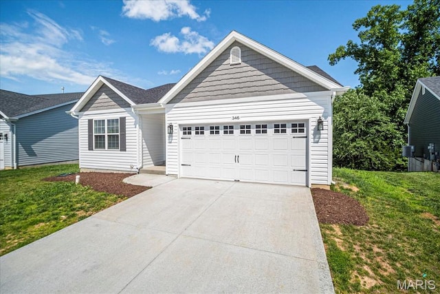 346 Fairhaven Ct, Wright City, MO 63390 - ranch-style home featuring driveway, an attached garage, and a front yard