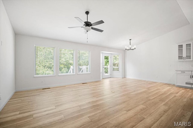 346 Fairhaven Ct, Wright City, MO 63390 - unfurnished living room with a chandelier, ceiling fan, and light wood-style flooring