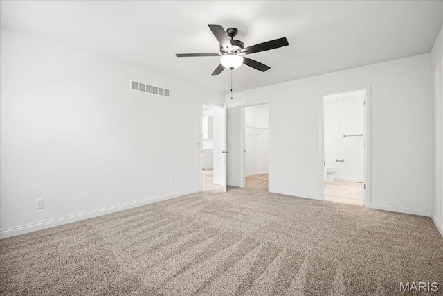 346 Fairhaven Ct, Wright City, MO 63390 - unfurnished bedroom with light colored carpet, a walk in closet, a closet, and ensuite bath