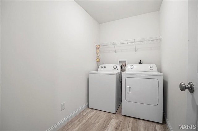 346 Fairhaven Ct, Wright City, MO 63390 - laundry area with washer and dryer and light wood-type flooring