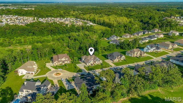 150 Westleigh Manor Dr, Wentzville, MO 63385 - aerial view of residential area featuring a heavily wooded area