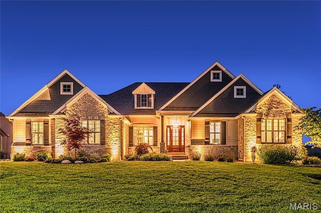 150 Westleigh Manor Dr, Wentzville, MO 63385 - craftsman-style house featuring stone siding, a front yard, and french doors