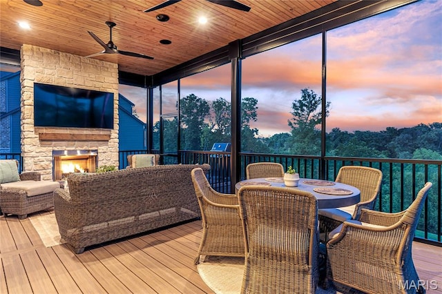 150 Westleigh Manor Dr, Wentzville, MO 63385 - sunroom featuring a ceiling fan, an outdoor living space with a fireplace, and outdoor dining space