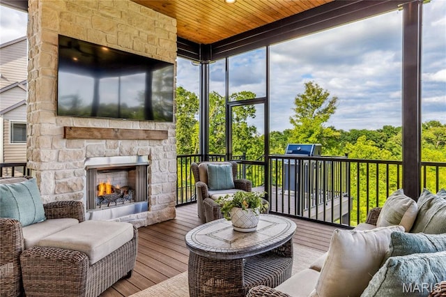 150 Westleigh Manor Dr, Wentzville, MO 63385 - sunroom / solarium with healthy amount of natural light and an outdoor living space with a fireplace