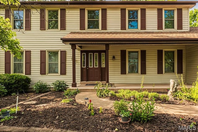 1461 Oak Bluff Ln, Kirkwood, MO 63122 - colonial inspired home featuring a porch and roof with shingles