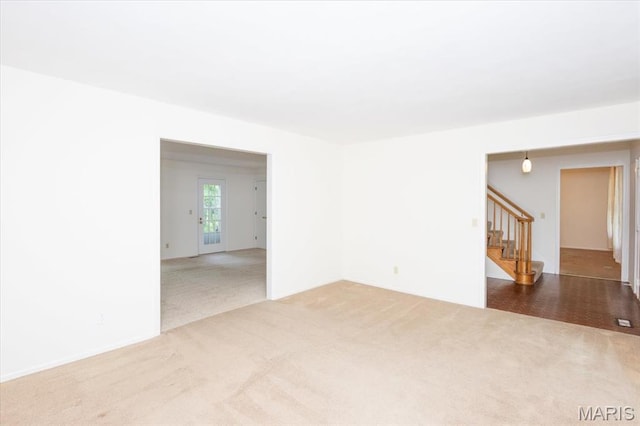 1461 Oak Bluff Ln, Kirkwood, MO 63122 - spare room featuring carpet and stairway