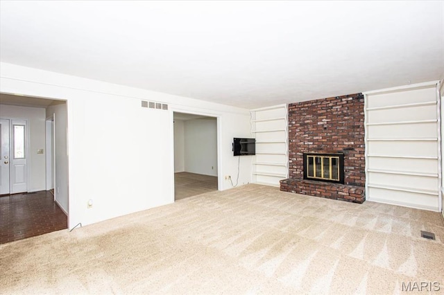 1461 Oak Bluff Ln, Kirkwood, MO 63122 - unfurnished living room with carpet and a fireplace
