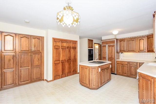 1461 Oak Bluff Ln, Kirkwood, MO 63122 - kitchen with light floors, a center island, brown cabinetry, and light countertops