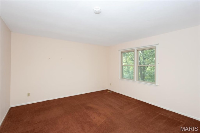 1461 Oak Bluff Ln, Kirkwood, MO 63122 - empty room with dark carpet and a smoke detector