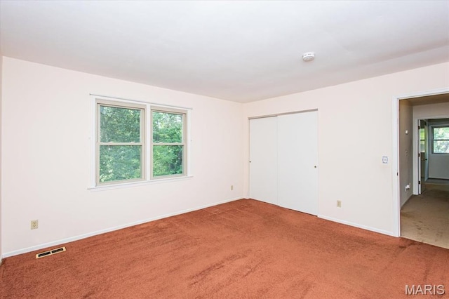 1461 Oak Bluff Ln, Kirkwood, MO 63122 - unfurnished bedroom featuring carpet floors and a closet