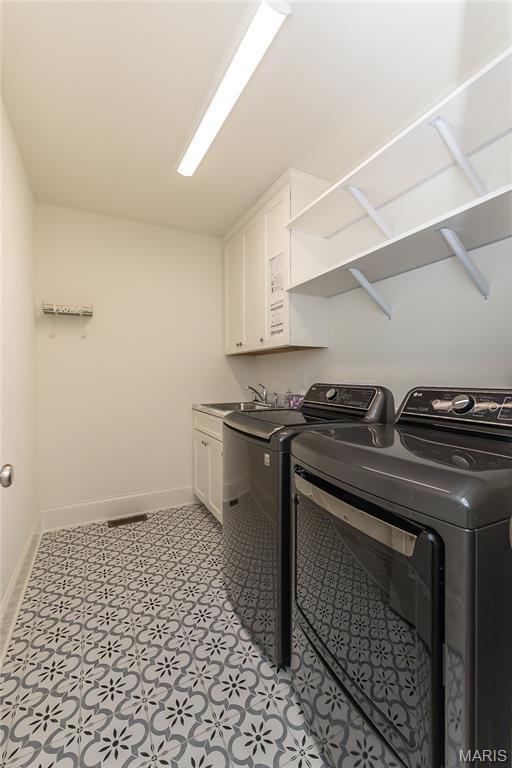 111 N Mosley Rd, Saint Louis, MO 63141 - laundry area with separate washer and dryer and cabinet space