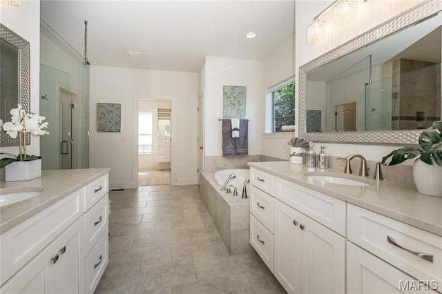 111 N Mosley Rd, Saint Louis, MO 63141 - full bathroom with two vanities, healthy amount of natural light, a stall shower, and recessed lighting