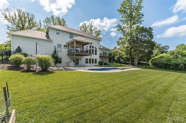 111 N Mosley Rd, Saint Louis, MO 63141 - back of property featuring a patio area, an outdoor pool, roof with shingles, a wooden deck, and a balcony