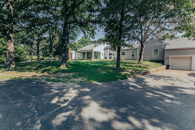 615 Corisande Hill Rd, Fenton, MO 63026 - ranch-style house featuring asphalt driveway, a front lawn, and a garage
