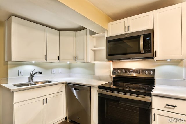 542 Meramec Station Rd Unit C, Valley Park, MO 63088 - kitchen featuring stainless steel appliances, a sink, open shelves, and light countertops