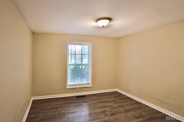 542 Meramec Station Rd Unit C, Valley Park, MO 63088 - unfurnished room with baseboards and dark wood-style flooring