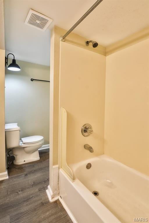 542 Meramec Station Rd Unit C, Valley Park, MO 63088 - bathroom featuring toilet, wood finished floors, and tub / shower combination