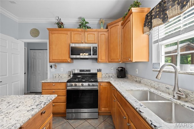 1171 Red Hawk Ridge Ln, Ofallon, IL 62269 - kitchen featuring appliances with stainless steel finishes, a sink, ornamental molding, light tile patterned floors, and light stone counters