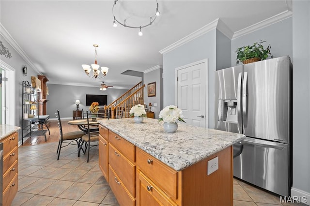 1171 Red Hawk Ridge Ln, Ofallon, IL 62269 - kitchen with stainless steel fridge, a chandelier, light tile patterned floors, crown molding, and a kitchen island