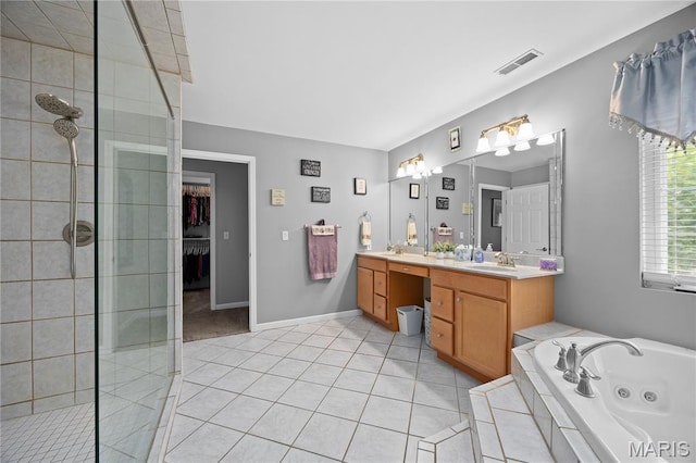 1171 Red Hawk Ridge Ln, Ofallon, IL 62269 - full bath featuring double vanity, a jetted tub, tiled shower, tile patterned flooring, and a walk in closet