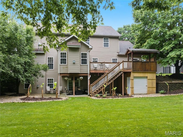 1171 Red Hawk Ridge Ln, Ofallon, IL 62269 - back of house with a lawn, stairway, a wooden deck, a patio area, and a shingled roof