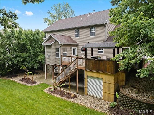 1171 Red Hawk Ridge Ln, Ofallon, IL 62269 - rear view of property featuring a wooden deck, stairway, roof with shingles, a lawn, and an attached garage