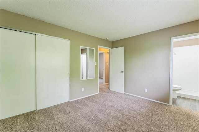 6250 Pennyrich Ct, Florissant, MO 63033 - unfurnished bedroom featuring carpet floors, a closet, baseboards, and a textured ceiling