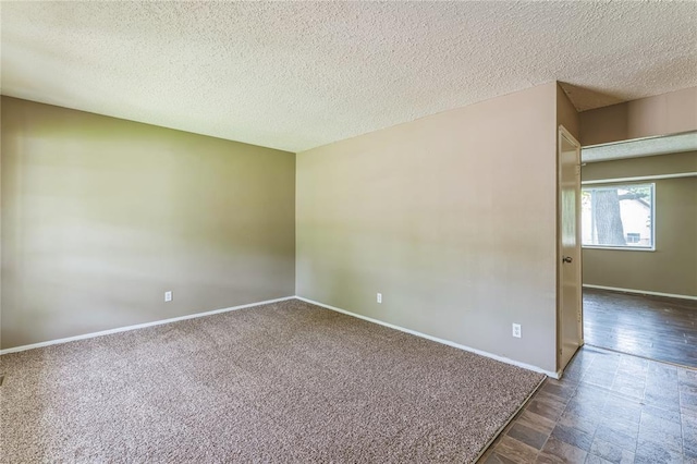 6250 Pennyrich Ct, Florissant, MO 63033 - spare room with a textured ceiling and baseboards