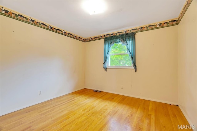 2631 Georgia Dr, Arnold, MO 63010 - unfurnished room featuring wood finished floors and baseboards