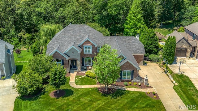 4388 Austin Pass Dr, Saint Charles, MO 63304 - view of front of home featuring a front lawn and a chimney