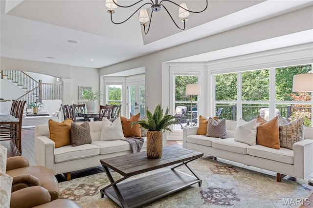 4388 Austin Pass Dr, Saint Charles, MO 63304 - living area featuring a chandelier, wood finished floors, recessed lighting, and stairway