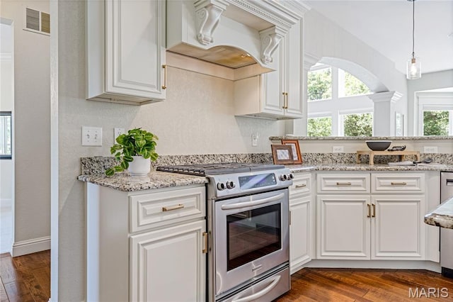 4388 Austin Pass Dr, Saint Charles, MO 63304 - kitchen featuring stainless steel electric range oven, dark wood-type flooring, premium range hood, white cabinetry, and decorative light fixtures