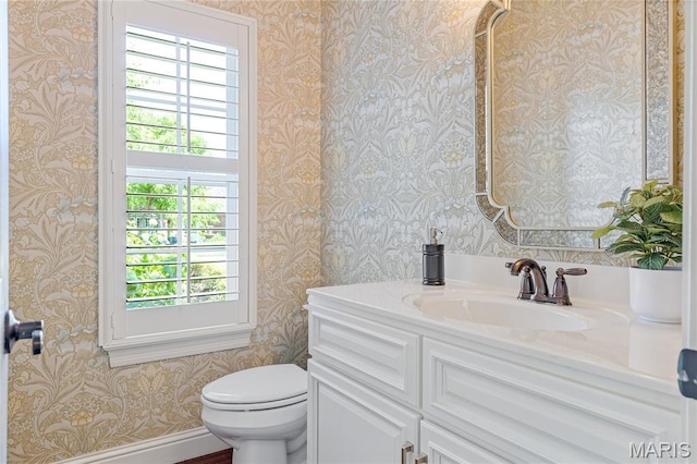 4388 Austin Pass Dr, Saint Charles, MO 63304 - half bath with wallpapered walls, plenty of natural light, and vanity