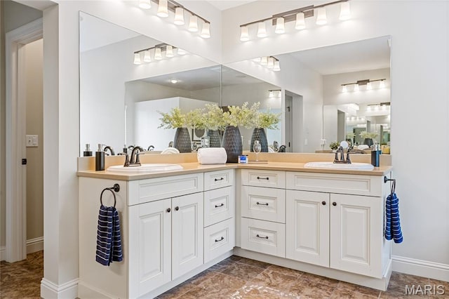 4388 Austin Pass Dr, Saint Charles, MO 63304 - bathroom with double vanity and baseboards
