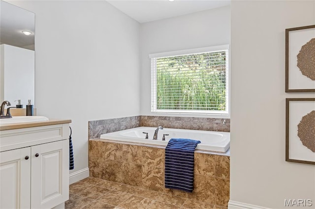 4388 Austin Pass Dr, Saint Charles, MO 63304 - bathroom featuring vanity, a bath, and tile patterned floors