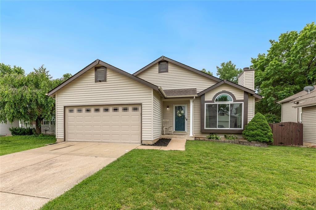 112 Hollow Creek Dr, Saint Peters, MO 63376 - ranch-style home featuring concrete driveway, an attached garage, and a chimney