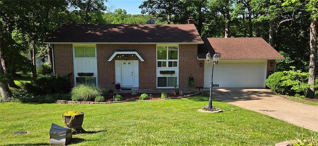 12276 Cedar Circle Dr, Saint Genevieve, MO 63670 - split foyer home featuring brick siding, a garage, concrete driveway, and a front lawn
