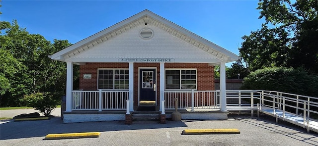 12276 Cedar Circle Dr, Saint Genevieve, MO 63670 - greek revival inspired property with covered porch, uncovered parking, and brick siding