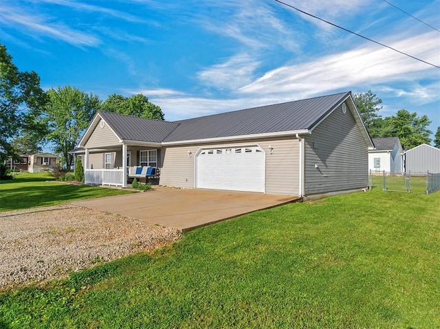 109 N 7th St, Owensville, MO 65066 - ranch-style home with driveway, covered porch, metal roof, and a garage