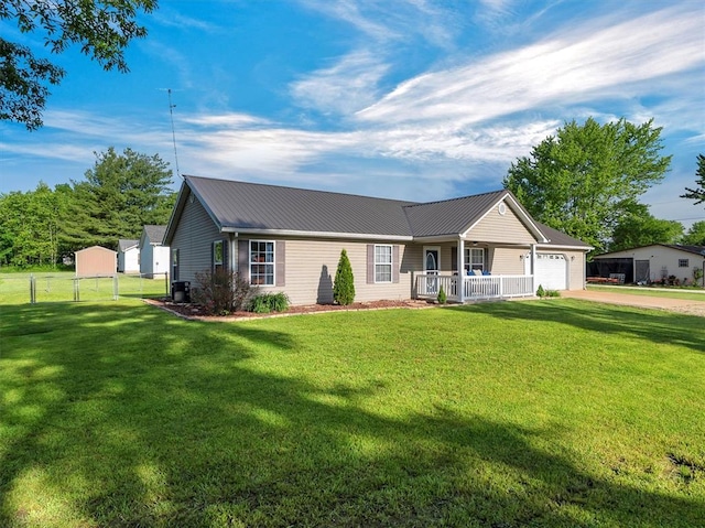 109 N 7th St, Owensville, MO 65066 - single story home featuring an attached garage, driveway, metal roof, a porch, and a gate