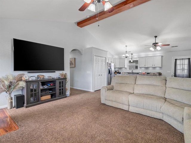 109 N 7th St, Owensville, MO 65066 - living room featuring a ceiling fan, arched walkways, and baseboards