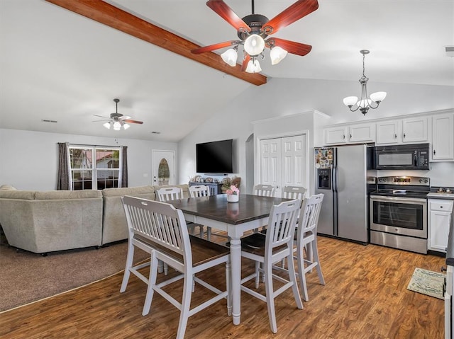 109 N 7th St, Owensville, MO 65066 - dining room featuring a ceiling fan, wood finished floors, and a chandelier