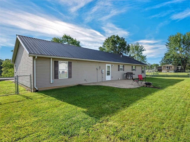 109 N 7th St, Owensville, MO 65066 - back of property with a patio, metal roof, and a gate