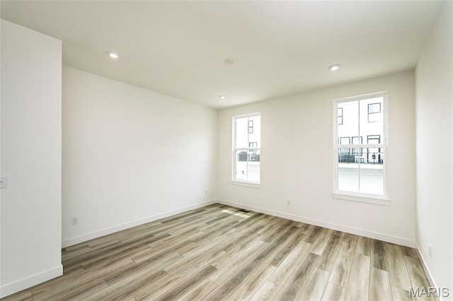 8916 Gateway Cir Unit 41-805, Richmond Heights, MO 63144 - spare room featuring plenty of natural light, light wood-style floors, and recessed lighting